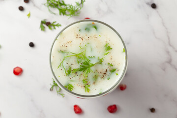 Close-Up of summer drink  Buttermilk or mattha or Chhachh glass garnished with coriander made with...