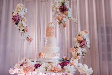 Delicious wedding reception. Birthday cake on a background party. Wedding cake on a background of...