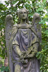 Obraz premium Historic Statue on the mystery old Prague Cemetery, Czech Republic