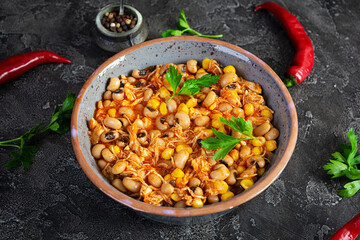 Chili con carne in a bowl. Mexican cuisine. Chili with meat, corn and beans