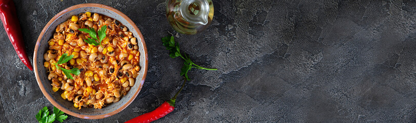 Chili con carne in a bowl. Mexican cuisine. Chili with meat, corn and beans