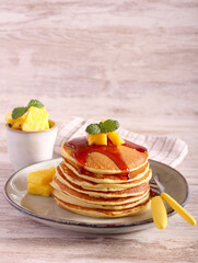 Pile of pancakes with pineapple