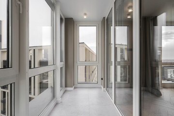 Modern loggia with large windows in the apartment - obrazy, fototapety, plakaty