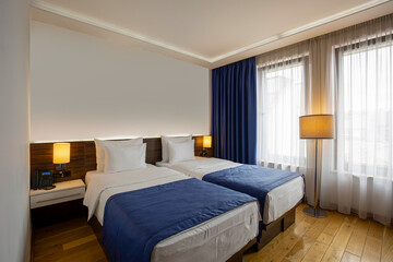 Interior of a double bed hotel bedroom in the morning