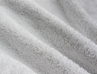 Towel texture closeup. Soft white cotton towel backdrop, fabric background. Terry cloth bath or beach towels. Soft fluffy Textile. Macro, texture - obrazy, fototapety, plakaty