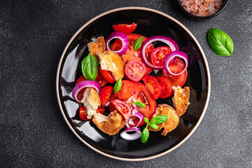 panzanella salad vegetables tomato, dried bread, onion healthy meal food snack diet on the table copy space food background rustic top view
