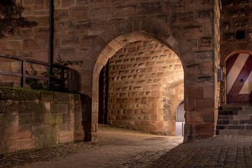 Part of historical city wall in Nuremberg illuminated in the evening