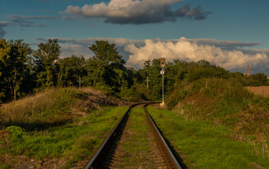 Old non electrified railway track near Rakovnik town in sunset evening