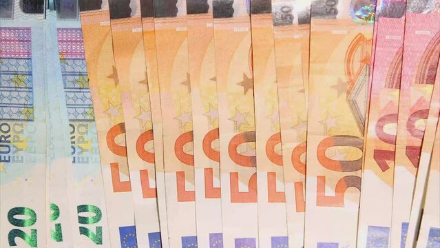 Stop Motion animation. Euro cash macro view. Financial Crisis. Texture. Finance Business Investment Success Concept. Euro money 50, 10, 20 euro bills view from the top. Seamlessly loop footage