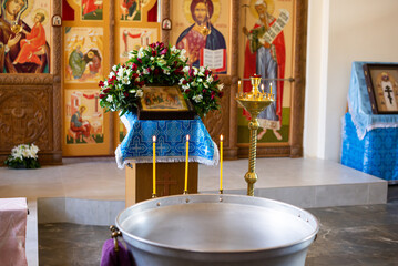 Holy water font for the baptism of children. Christian religious ceremony.