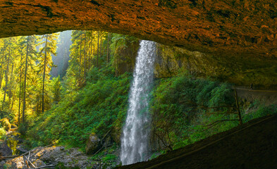 Rainforest waterfalls overflowing from the volcanic rock cave at at North Falls in the Silver Falls State Park near Salem, Marion County, Oregon