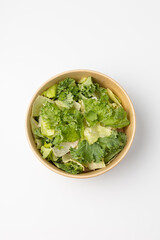 Poke with green salad on white background