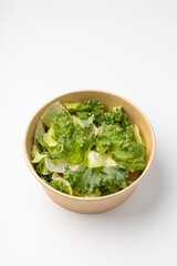 Poke with green salad on white background
