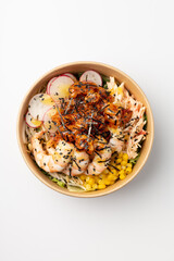 Poke with shrimp, corn and green onions on a white background