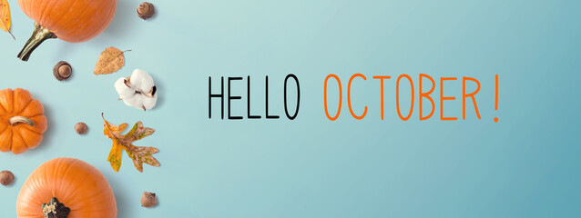 Hello October message with autumn pumpkins with leaves