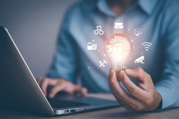 thinking and creative concept, Close up the light bulb and man working on the desk, Creativity, and innovation are keys to success,  new idea and innovation with Brain and light bulbs,big data