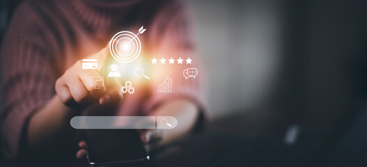Businesswoman hand using smartphone to use search engine optimization SEO tools for finding customer or promote and advertise about content online for marketing technology and business concept.