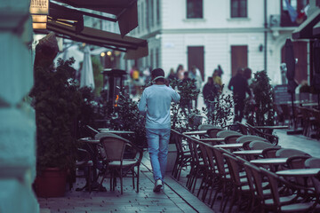 Person walking in the city with headphones