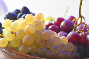 Close-up on three different colors of grape