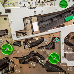 background of the drive gear and mechanisms of the metal dispenser ATM