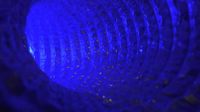 Blinking light coming through futuristic tunnel