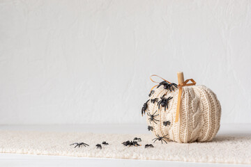 Modern interior decoration for halloween celebration with handmade knit pumpkin, spiders, bats