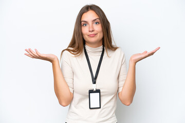 Young pretty woman with ID card isolated on white background having doubts while raising hands