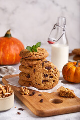 Obraz na płótnie Canvas Cookies with pumpkin, walnuts and dark chocolate. Delicious homemade dessert.