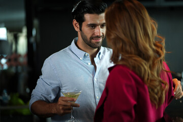 Man and woman flirting with each other in bar At Evening Party. Romantic couple dating at night in pub. couple dating , propose marriage. Romantic couple on a date sitting in a restaurant.