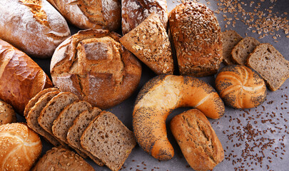 Fototapeta na wymiar Assorted bakery products including loafs of bread and rolls
