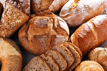 Assorted bakery products including loafs of bread and rolls