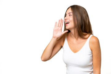 Young pretty woman over isolated background shouting with mouth wide open to the side