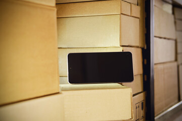 Phone is in the warehouse room. The crisis of smartphone delivery and problems with the logistics of technological goods.