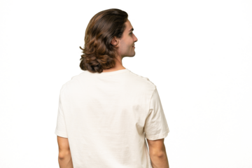 Young caucasian man isolated on green chroma background in back position and looking side