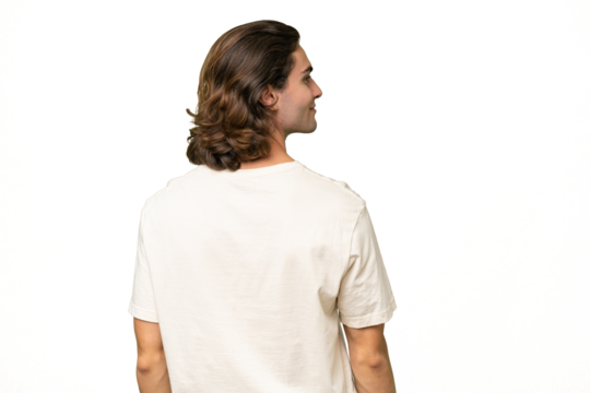 Young caucasian man isolated on green chroma background in back position and looking side