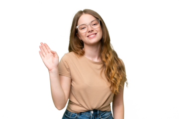 Young pretty woman over isolated background saluting with hand with happy expression