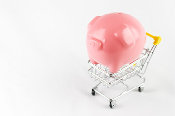 ショッピングカートと豚の貯金箱