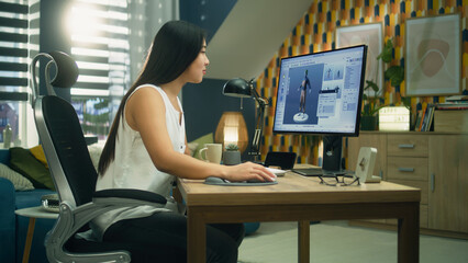 Asian 3D designer creating 3D model of style and design of clothes in professional program on...
