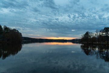 Fototapeta na wymiar sunrise over the lake with reflections