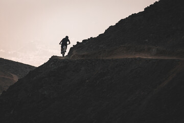 silhouette of a person riding his bike. MTB