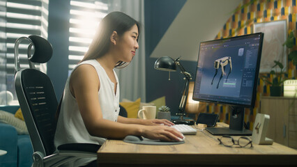 Asian woman working on pc in 3D modeling program remotely from home office and creating 3D...
