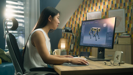 Asian woman working on pc in 3D modeling program remotely from home office and creating 3D...