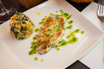 Image of tasty grilled tuna with garlic and parsley, served with rice