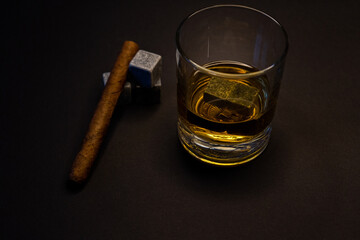 whiskey with cooling stone cubes and cigar