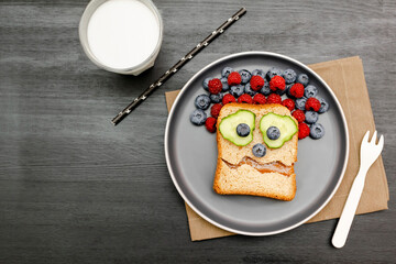 Funny scary monster face smile on halloween sandwich toast bread with peanut butter, blueberry,...
