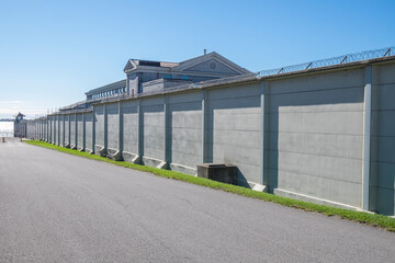 Fototapeta na wymiar The wall of a prison disappears into the distance in Kingston Ontario Canada.