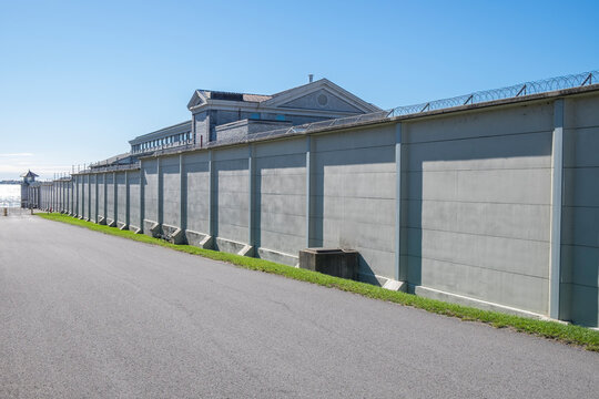 The wall of a prison disappears into the distance in Kingston Ontario Canada.