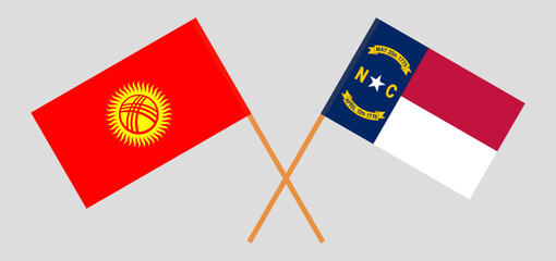 Crossed flags of Kyrgyzstan and The State of North Carolina. Official colors. Correct proportion