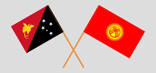 Crossed flags of Papua New Guinea and Kyrgyzstan. Official colors. Correct proportion