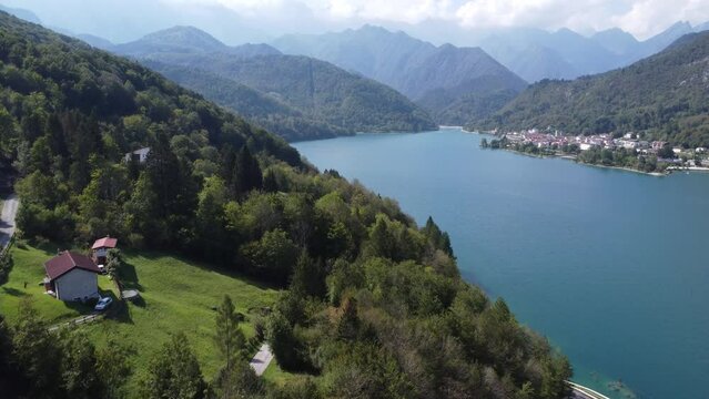 Scenic aerial footage of Barcis, Italy. Fascinating aerial views of Barcis Village, Lake Barcis and Dolomites mountains (Alps).